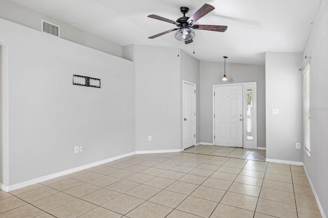 7233 Lumber Port Dr, Ruskin, FL 33573 - entryway with light tile patterned flooring, ceiling fan, and vaulted ceiling
