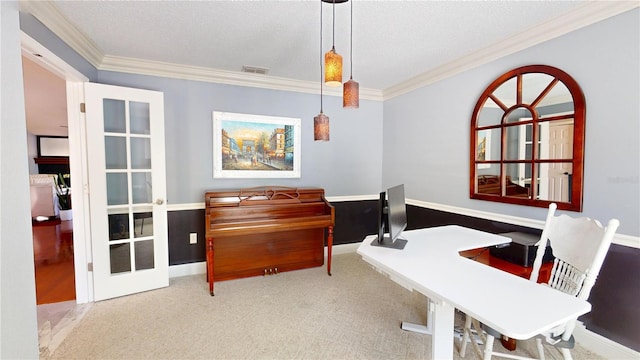 sitting room featuring visible vents, carpet floors, a textured ceiling, and crown molding