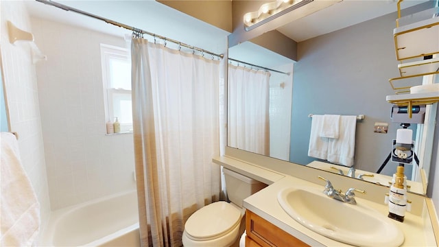 bathroom with toilet, vanity, and shower / bathtub combination with curtain