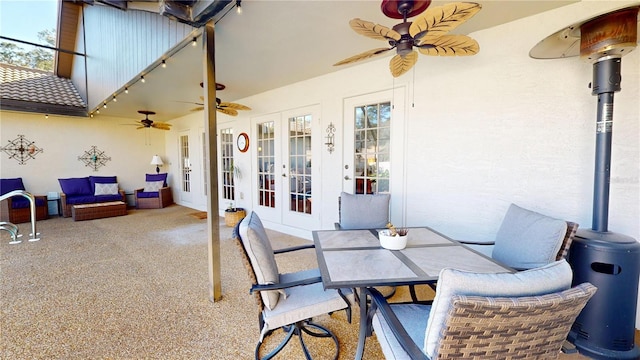 view of patio / terrace featuring french doors, outdoor dining area, and ceiling fan