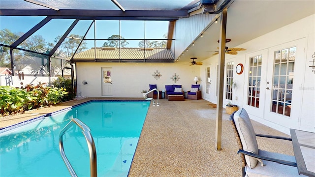 view of pool featuring a fenced in pool, glass enclosure, french doors, a patio, and a ceiling fan