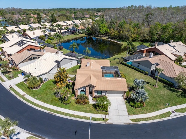 bird's eye view featuring a residential view and a water view