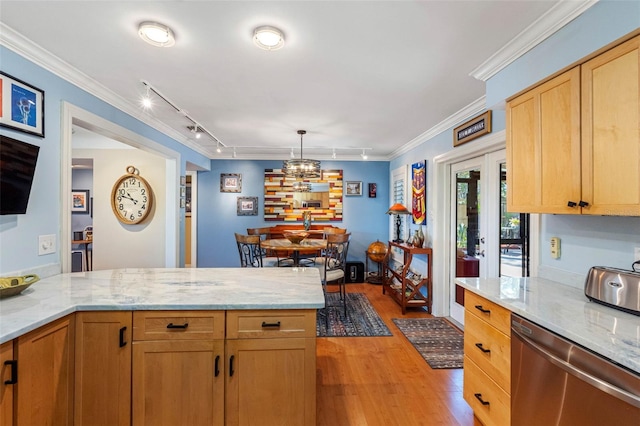 kitchen featuring light wood finished floors, crown molding, light stone countertops, a peninsula, and stainless steel dishwasher