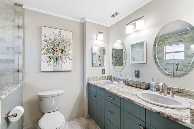 bathroom with a sink, visible vents, tiled shower, and crown molding