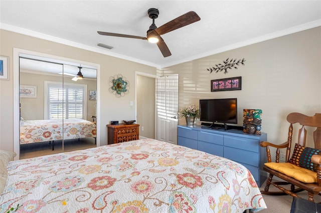 bedroom with visible vents, a closet, ceiling fan, and crown molding