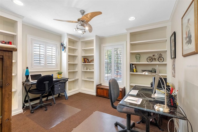 office featuring built in shelves, ceiling fan, dark carpet, ornamental molding, and recessed lighting