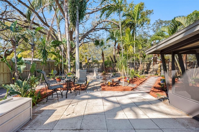 view of patio featuring outdoor dining space and a fenced backyard