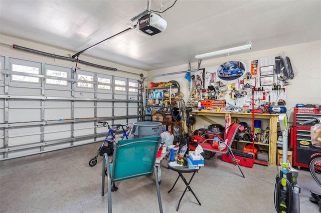 garage featuring a workshop area and a garage door opener