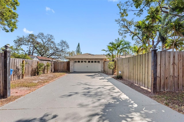 exterior space featuring fence and driveway