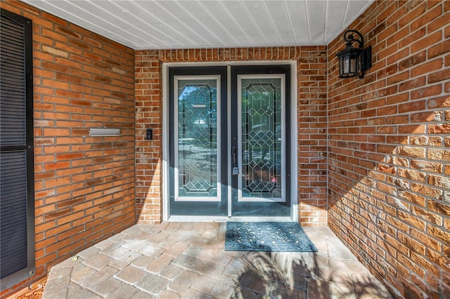 entrance to property with brick siding