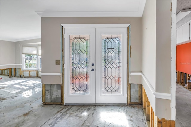 foyer entrance with french doors and ornamental molding