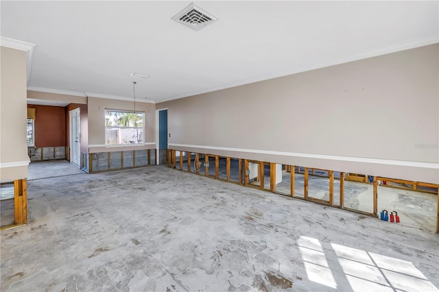 empty room with visible vents, unfinished concrete flooring, and ornamental molding