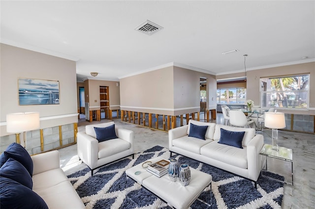 living room with visible vents, concrete flooring, and ornamental molding