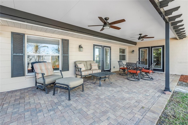 view of patio with outdoor lounge area, outdoor dining space, and a ceiling fan