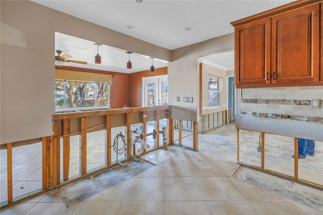 kitchen with light tile patterned floors, tasteful backsplash, and pendant lighting