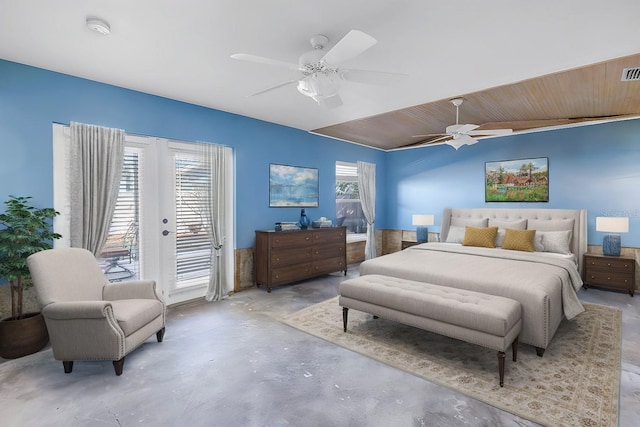 bedroom with visible vents, a ceiling fan, french doors, concrete flooring, and access to exterior