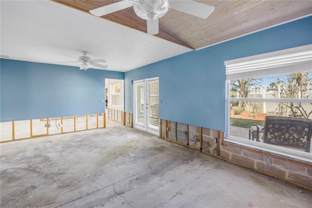 spare room featuring concrete flooring and ceiling fan