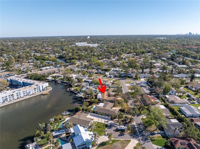 drone / aerial view with a water view and a residential view