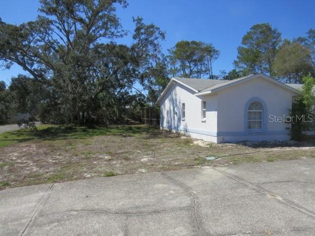 view of property exterior with stucco siding