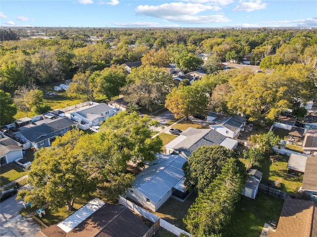 birds eye view of property with a forest view and a residential view