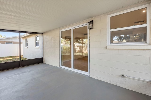 unfurnished sunroom featuring a wealth of natural light