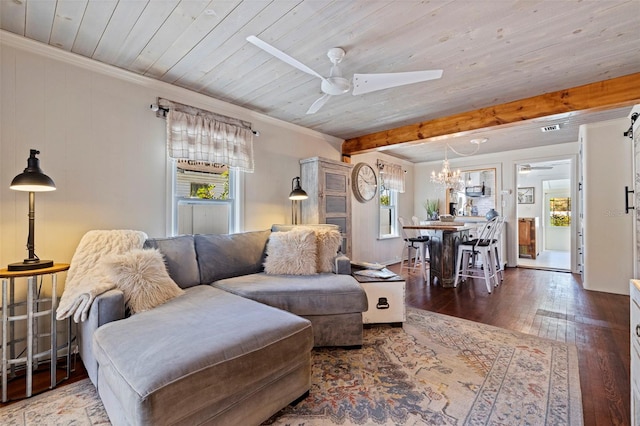 living area featuring plenty of natural light, ceiling fan with notable chandelier, and hardwood / wood-style floors