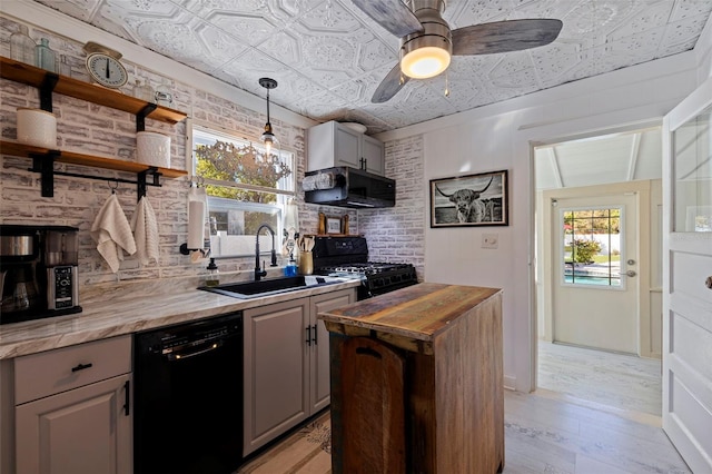 kitchen featuring a sink, wooden counters, an ornate ceiling, black appliances, and open shelves