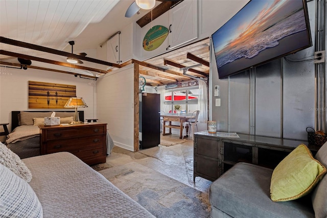 bedroom featuring beamed ceiling, wood ceiling, and stone finish flooring