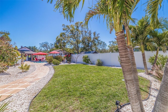 view of yard featuring a patio and a fenced backyard