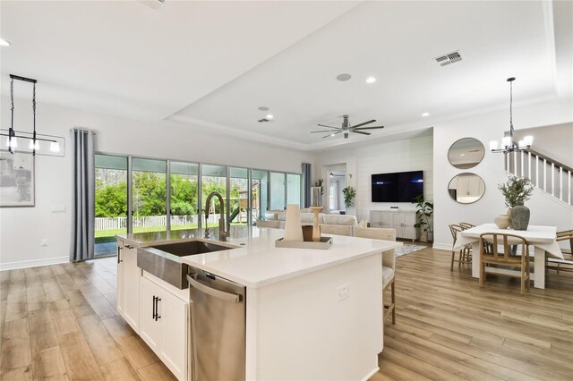 8766 Shadyside Ln, Land O Lakes, FL 34637 - kitchen featuring stainless steel dishwasher, a sink, recessed lighting, ceiling fan, and light wood-style floors