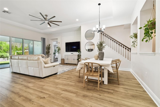 8766 Shadyside Ln, Land O Lakes, FL 34637 - living room with light wood finished floors, a chandelier, a tray ceiling, recessed lighting, and ceiling fan