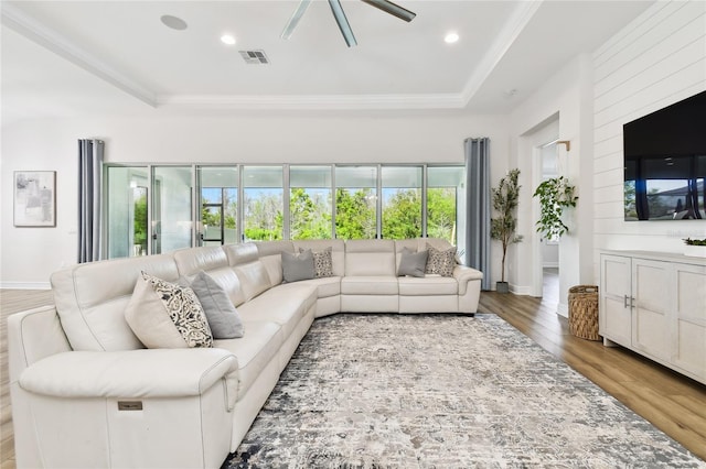 8766 Shadyside Ln, Land O Lakes, FL 34637 - living room with plenty of natural light, a ceiling fan, wood finished floors, ornamental molding, and recessed lighting