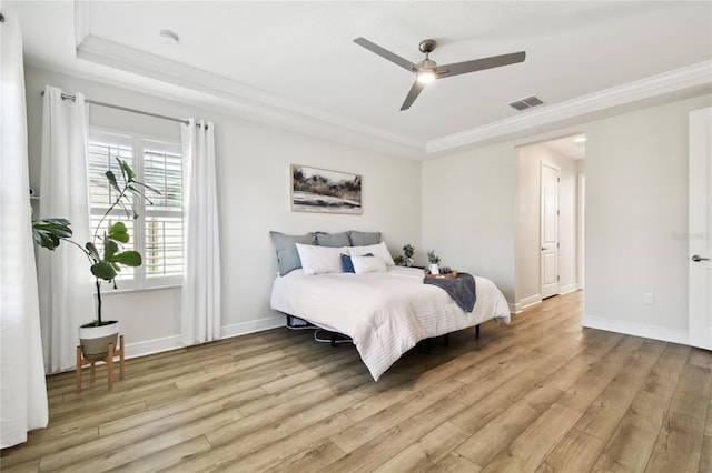8766 Shadyside Ln, Land O Lakes, FL 34637 - bedroom with light wood-style flooring, ornamental molding, baseboards, and a ceiling fan