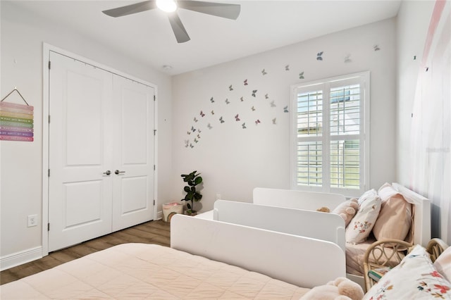 8766 Shadyside Ln, Land O Lakes, FL 34637 - bedroom with wood finished floors, a closet, baseboards, and ceiling fan