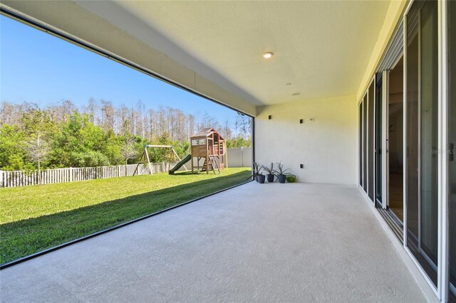 8766 Shadyside Ln, Land O Lakes, FL 34637 - view of patio / terrace with a playground
