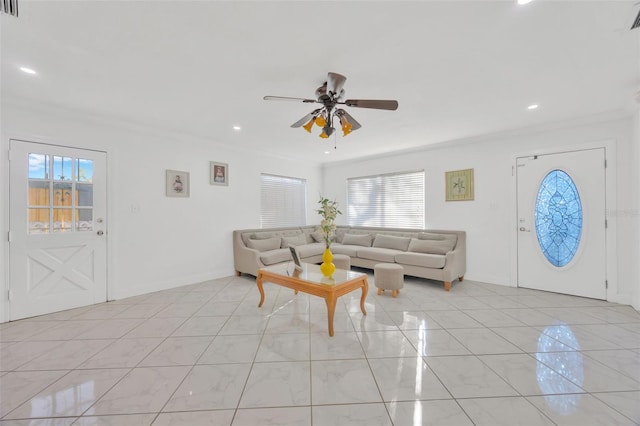 living room with ornamental molding, a ceiling fan, recessed lighting, light tile patterned flooring, and baseboards