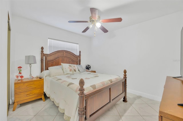 bedroom featuring baseboards and ceiling fan