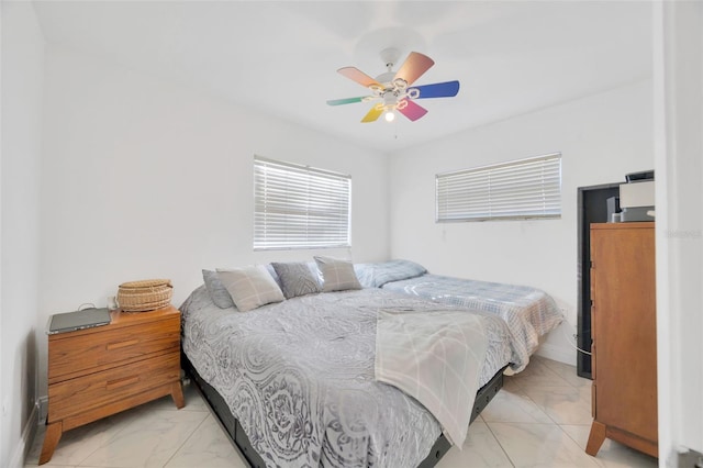 bedroom with baseboards, marble finish floor, and ceiling fan