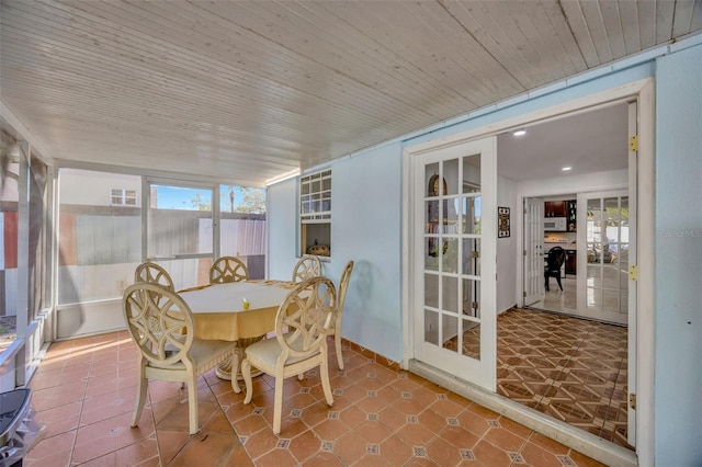 sunroom / solarium featuring wooden ceiling