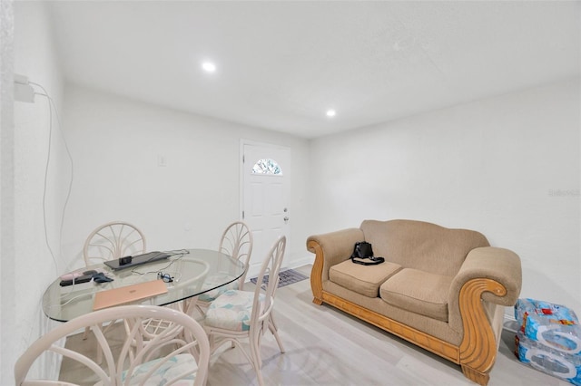 dining space featuring recessed lighting and light wood-style flooring