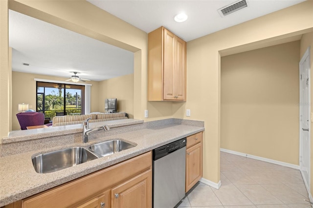 kitchen featuring light tile patterned floors, visible vents, a sink, light brown cabinetry, and stainless steel dishwasher