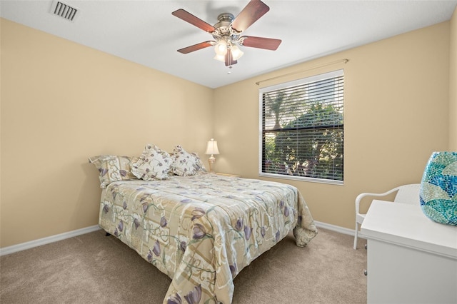 bedroom with visible vents, baseboards, a ceiling fan, and carpet flooring