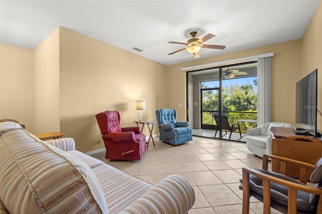 living room featuring light tile patterned floors, baseboards, visible vents, and ceiling fan