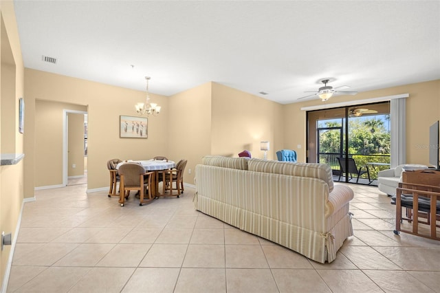 living area featuring light tile patterned floors, baseboards, and visible vents