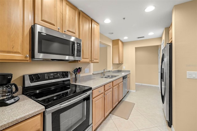 kitchen featuring visible vents, light tile patterned flooring, recessed lighting, a sink, and appliances with stainless steel finishes