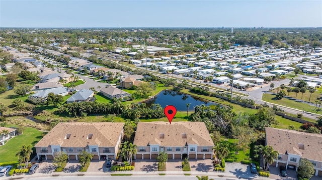 birds eye view of property with a residential view and a water view