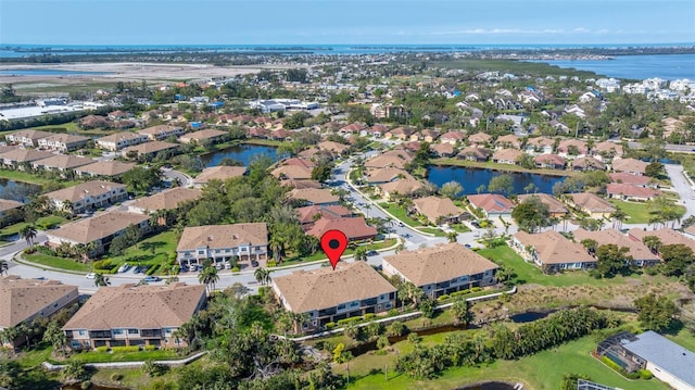 birds eye view of property featuring a residential view and a water view