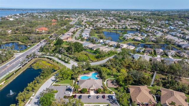 birds eye view of property featuring a residential view and a water view