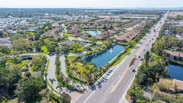 birds eye view of property featuring a residential view and a water view