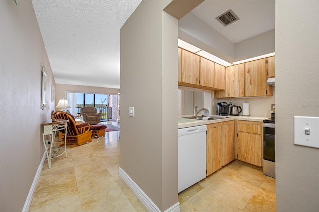 kitchen with visible vents, a sink, light countertops, stainless steel electric range oven, and dishwasher